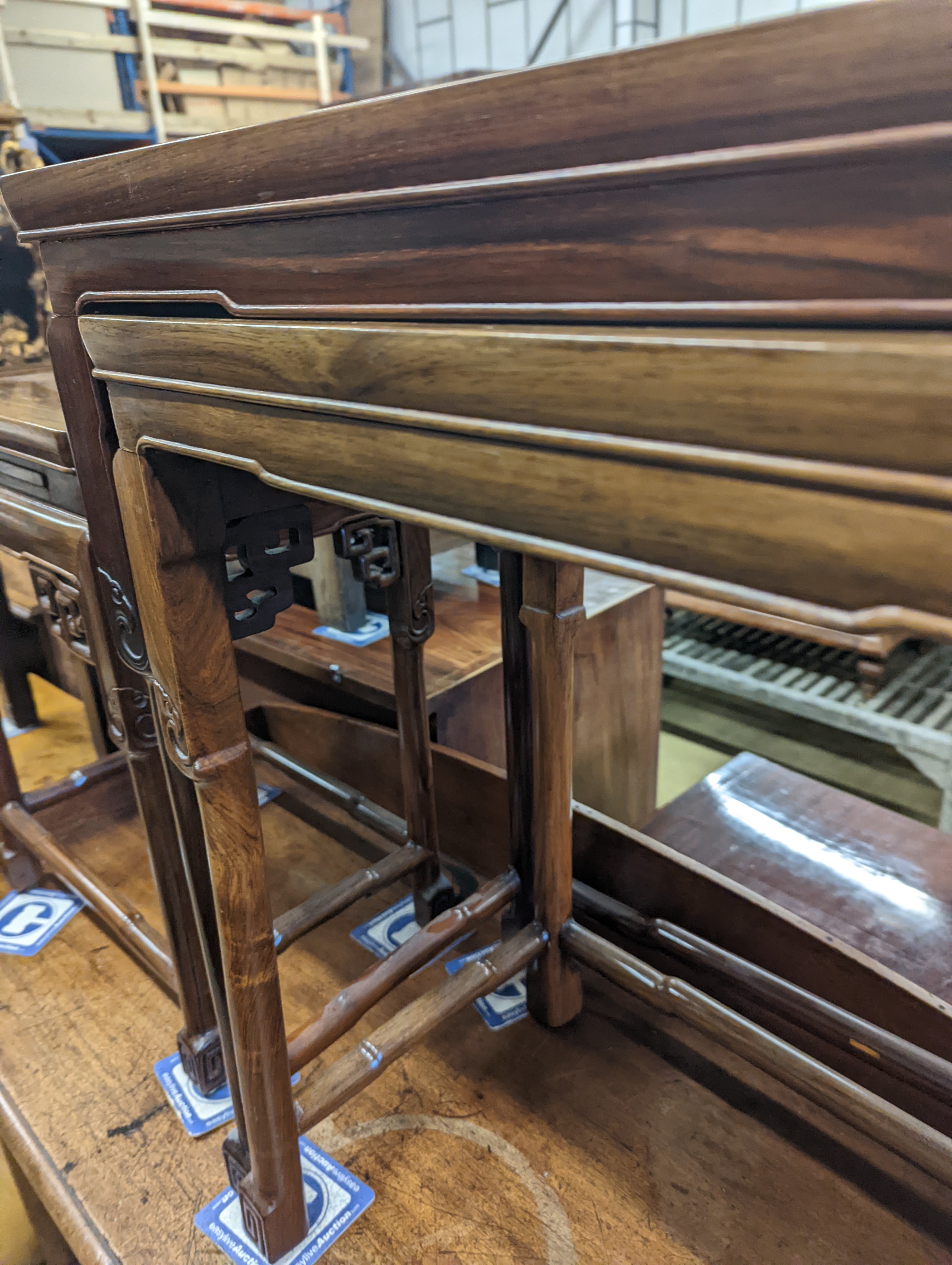 A nest of three Chinese rectangular tea tables, width 61cm, depth 36cm, height 66cm